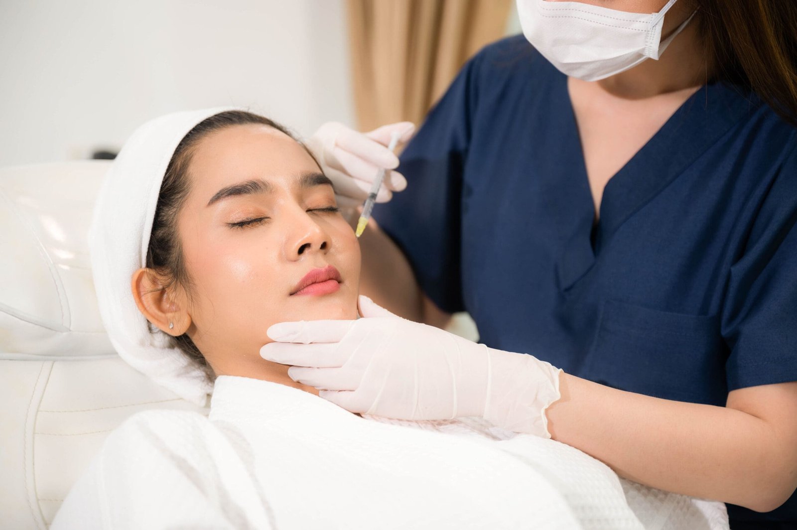 young Asian woman making cosmetology treatment skin injection, Mesotherapy of face beauty care